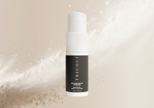 Tricoci Boost Powder product in elegant black container with white logo, volume-enhancing hair styling powder